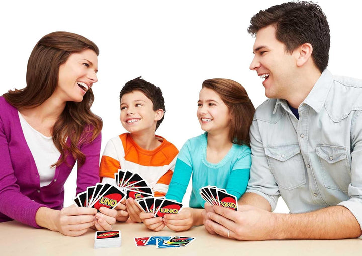 Children learning to play UNO, focusing on early childhood development